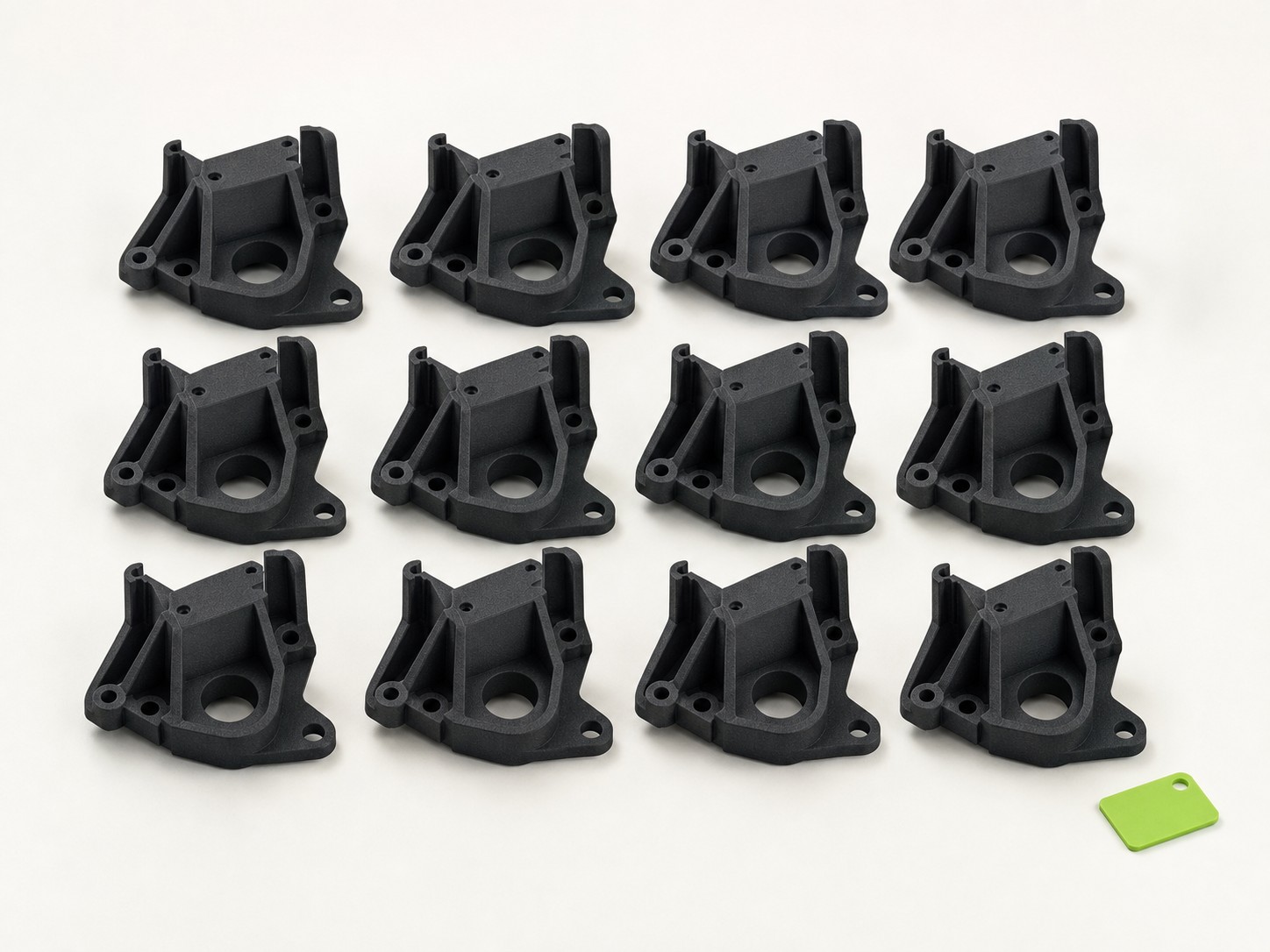 A short production run of identical black nylon brackets
